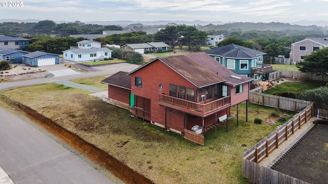 drone / aerial view featuring a residential view and a mountain view