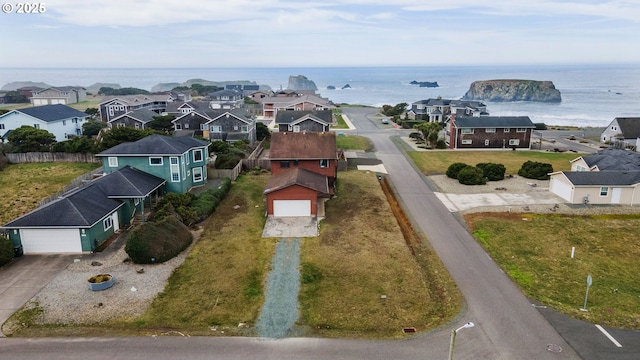 aerial view with a residential view and a water view