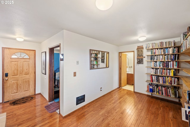 foyer with light wood-type flooring