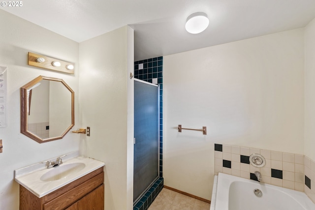 full bath with a stall shower, vanity, baseboards, and a bath