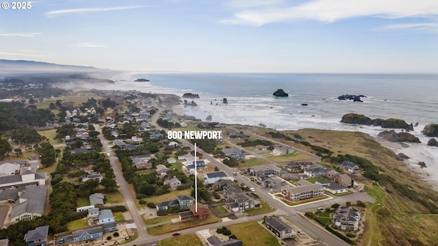 drone / aerial view featuring a water view and a residential view