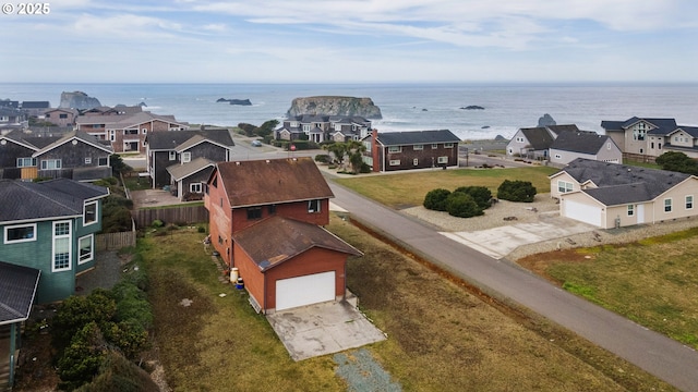 birds eye view of property featuring a water view and a residential view