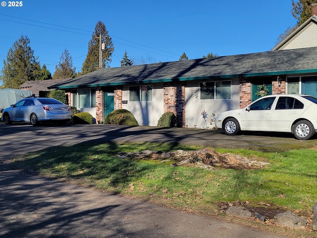 view of home's exterior with a yard