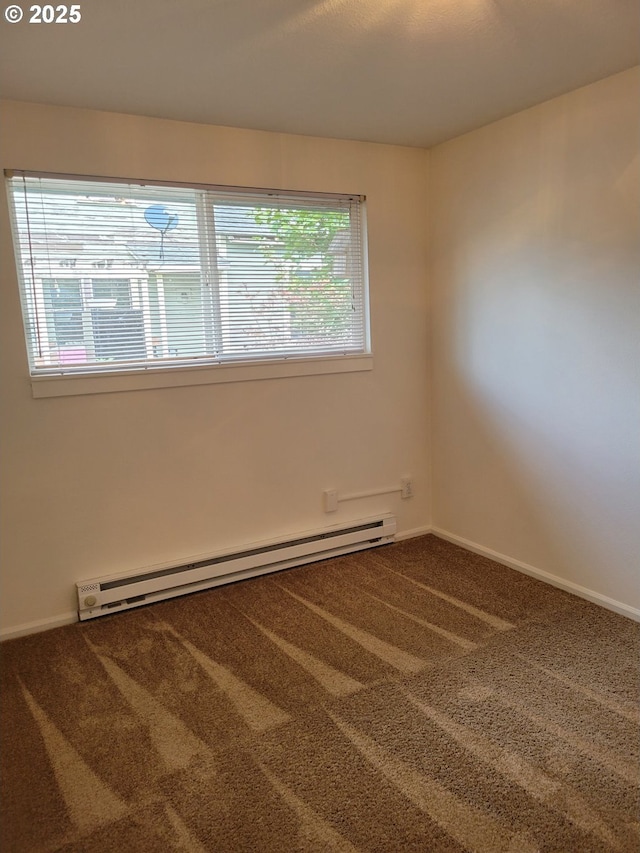 carpeted empty room featuring a baseboard radiator