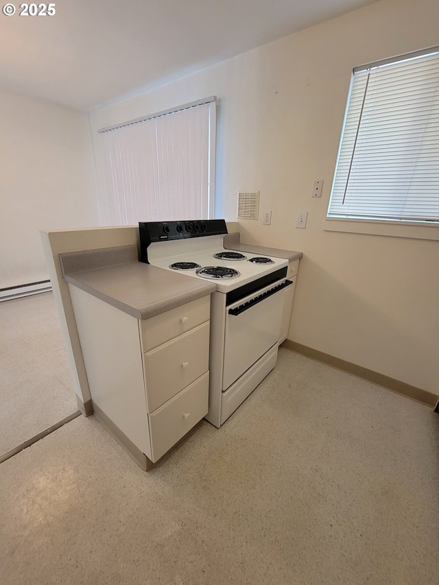 kitchen featuring white electric stove and a baseboard radiator