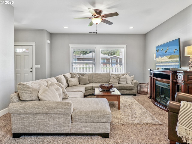 carpeted living area with a ceiling fan and recessed lighting