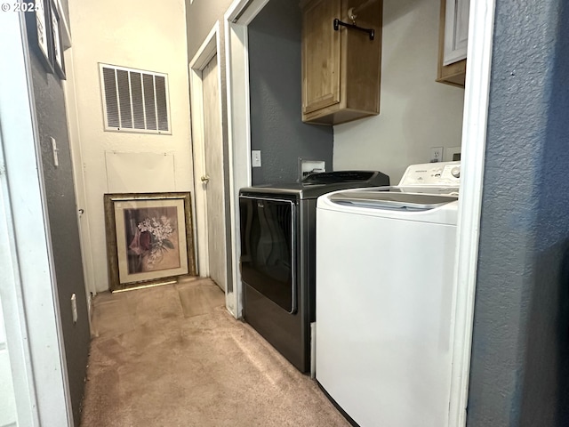 5510 E St, Springfield, OR 97478 - washroom featuring independent washer and dryer, cabinet space, and light carpet
