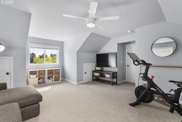exercise room featuring ceiling fan, light carpet, baseboards, and lofted ceiling
