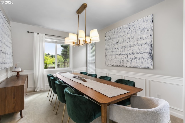 21890 SW 106th Ave, Tualatin, OR 97062 - dining room with a chandelier, wainscoting, light carpet, and a decorative wall