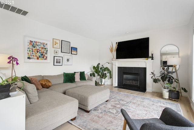 21890 SW 106th Ave, Tualatin, OR 97062 - living room with wood finished floors and a tiled fireplace