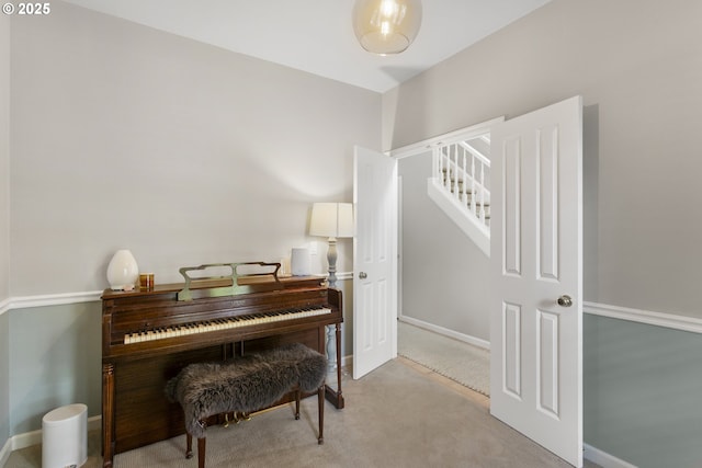 21890 SW 106th Ave, Tualatin, OR 97062 - living area with light colored carpet, baseboards, and stairway