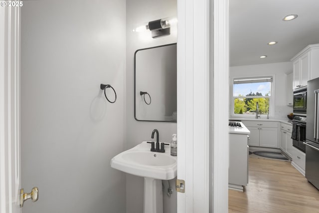 21890 SW 106th Ave, Tualatin, OR 97062 - bathroom featuring recessed lighting and wood finished floors
