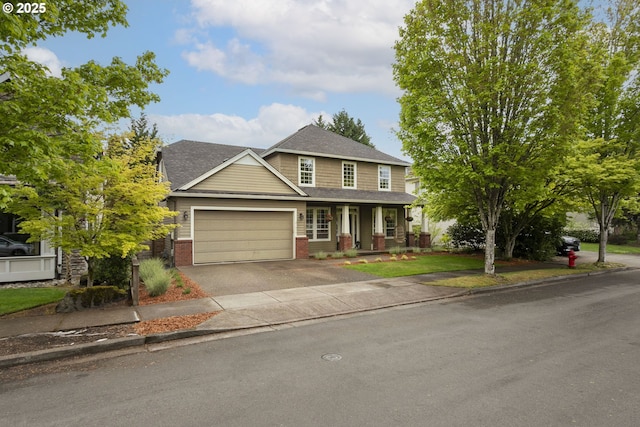view of front of house featuring roof with shingles, an attached garage, brick siding, concrete driveway, and covered porch
