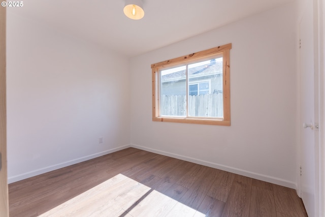 1636 Maple St, Myrtle Point, OR 97458 - spare room featuring wood finished floors and baseboards