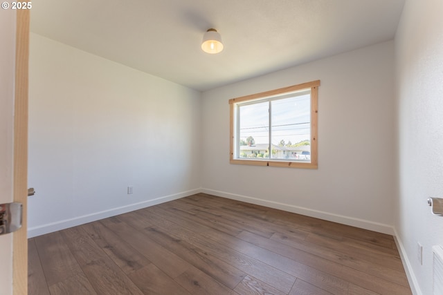 1636 Maple St, Myrtle Point, OR 97458 - spare room featuring dark wood-style flooring and baseboards