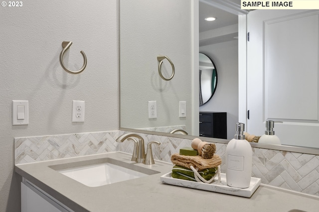 8809 S 3rd St Unit 35, Ridgefield, WA 98642 - bathroom featuring decorative backsplash and vanity