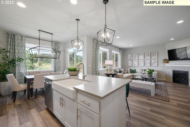 8809 S 3rd St Unit 35, Ridgefield, WA 98642 - kitchen with a chandelier, stainless steel dishwasher, recessed lighting, dark wood-type flooring, and white cabinetry