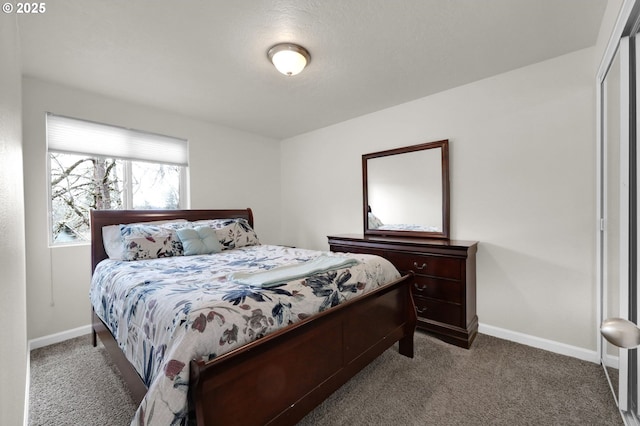 bedroom featuring baseboards and carpet floors