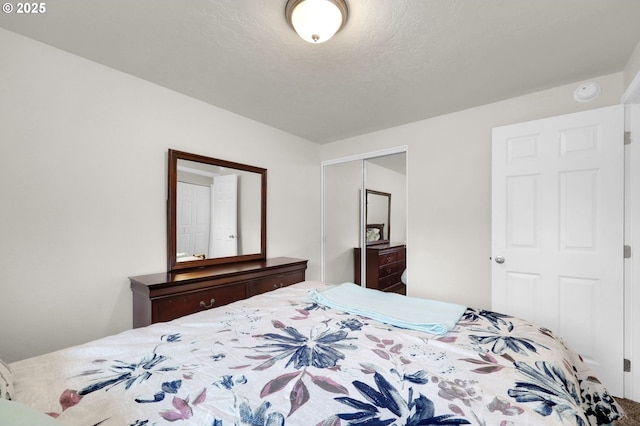 bedroom featuring a closet and a textured ceiling