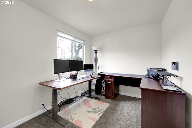 carpeted office space featuring baseboards