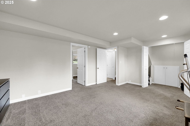 below grade area featuring recessed lighting, baseboards, and carpet