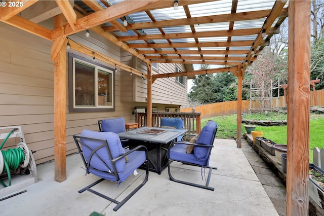 view of patio / terrace featuring a pergola, an outdoor fire pit, and fence