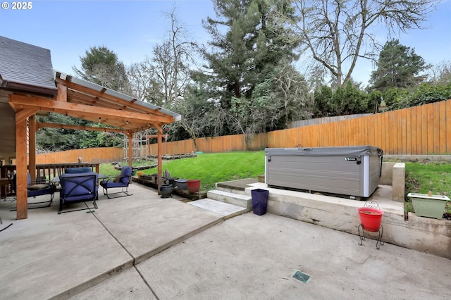 view of patio / terrace with a hot tub, a fenced backyard, and a pergola