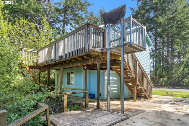 exterior space featuring a deck and stairs