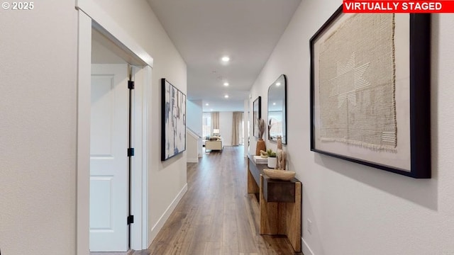 corridor with wood-type flooring