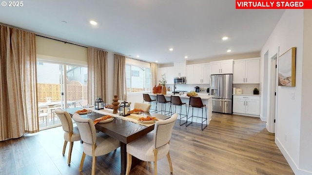 dining space featuring light hardwood / wood-style flooring