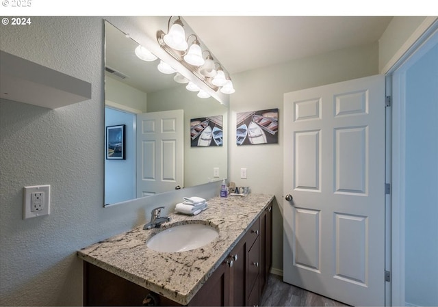 bathroom with visible vents and vanity