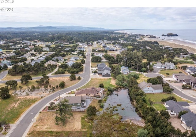 birds eye view of property with a water view and a residential view