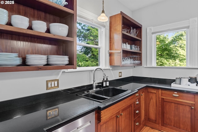 2325 A St, Forest Grove, OR 97116 - kitchen with open shelves, stainless steel dishwasher, a sink, dark countertops, and brown cabinetry