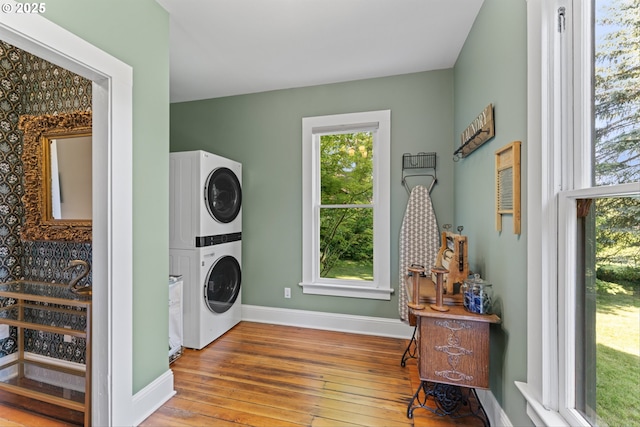 2325 A St, Forest Grove, OR 97116 - laundry area with stacked washer and clothes dryer, hardwood / wood-style flooring, and baseboards