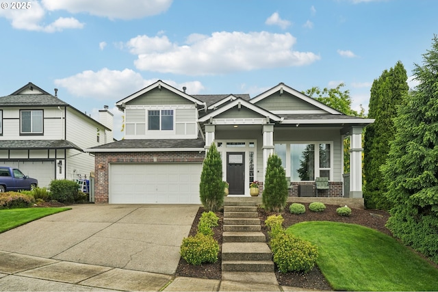 4709 SE Antelope Hills Dr, Gresham, OR 97080 - craftsman-style house with brick siding, driveway, a garage, a front yard, and covered porch