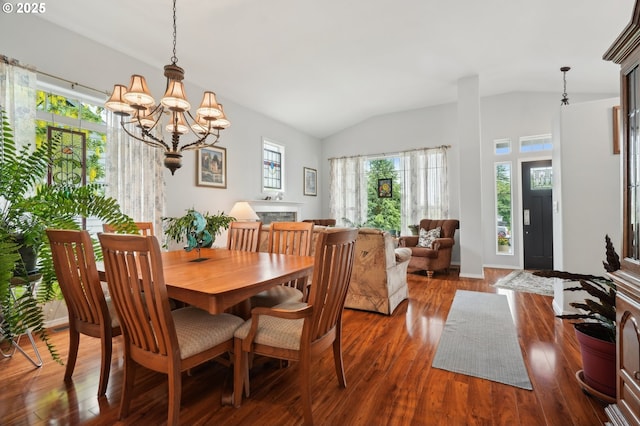 4709 SE Antelope Hills Dr, Gresham, OR 97080 - dining room featuring vaulted ceiling, healthy amount of natural light, a chandelier, and dark wood-type flooring