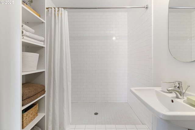 1507 SE 45th Ave Unit 308, Portland, OR 97215 - full bathroom featuring a sink, tiled shower, and tile patterned floors