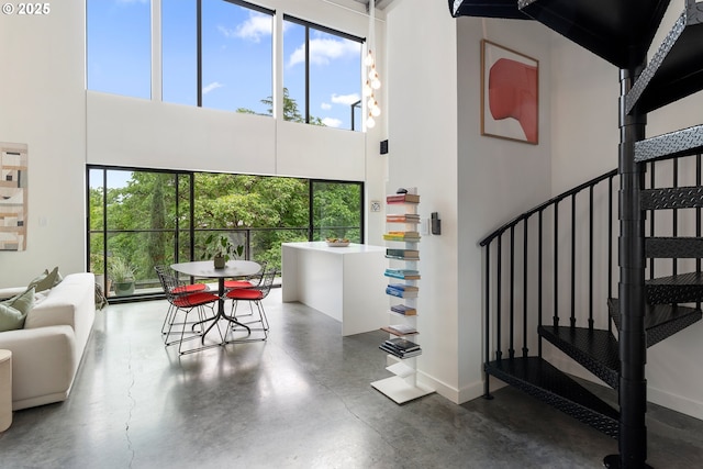 1507 SE 45th Ave Unit 308, Portland, OR 97215 - interior space featuring a high ceiling, concrete floors, and baseboards