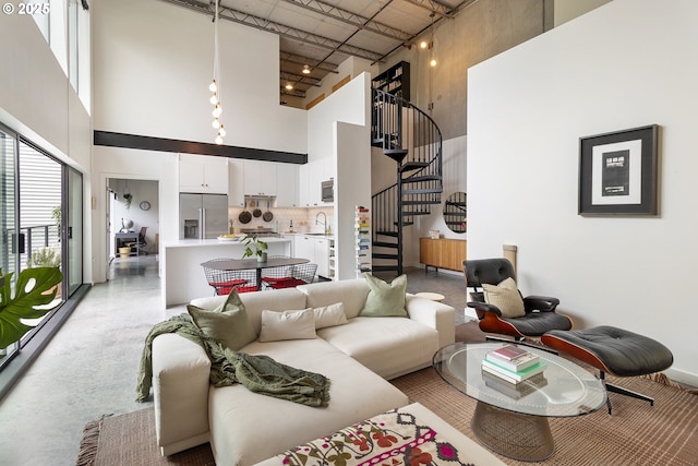 1507 SE 45th Ave Unit 308, Portland, OR 97215 - living area featuring a towering ceiling and stairs
