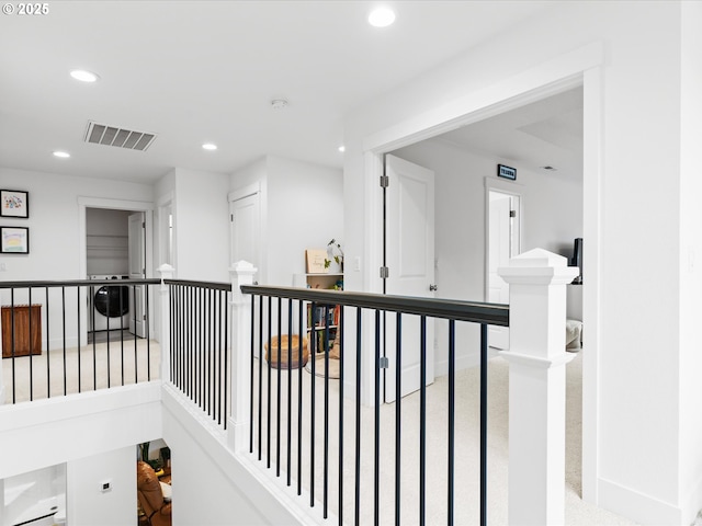 corridor with baseboards, visible vents, and recessed lighting