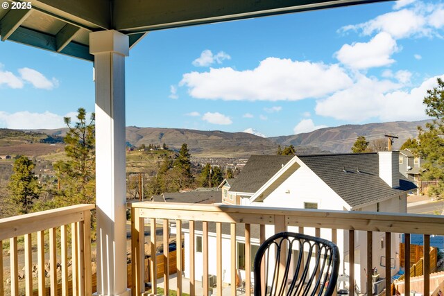 dining area featuring a mountain view, light hardwood / wood-style flooring, and a chandelier