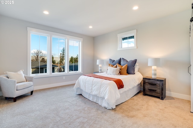 carpeted bedroom with multiple windows