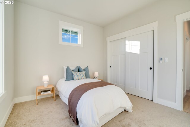 carpeted bedroom featuring a closet