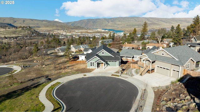 birds eye view of property featuring a mountain view