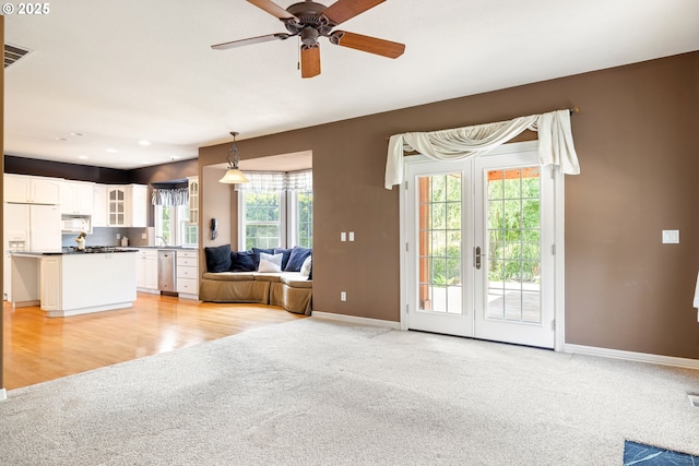 2103 N Teakwood St, Canby, OR 97013 - living room with light colored carpet, a ceiling fan, and french doors
