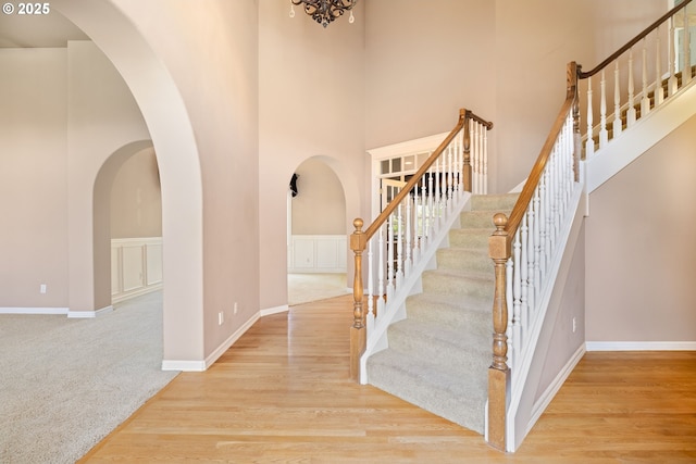 2103 N Teakwood St, Canby, OR 97013 - foyer featuring a high ceiling, arched walkways, stairway, and carpet flooring