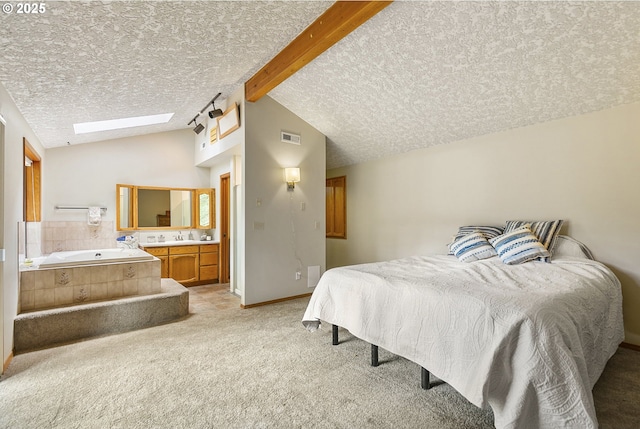 14216 NE 346th St, Battle Ground, WA 98604 - bedroom with lofted ceiling, light colored carpet, a textured ceiling, a skylight, and ensuite bath