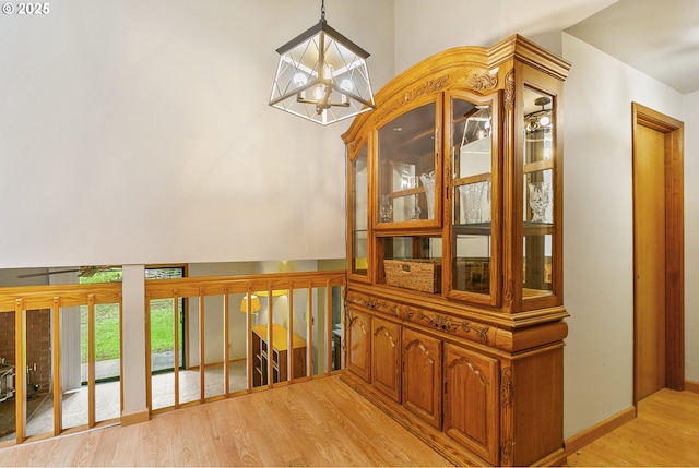14216 NE 346th St, Battle Ground, WA 98604 - corridor featuring a chandelier and light wood-type flooring