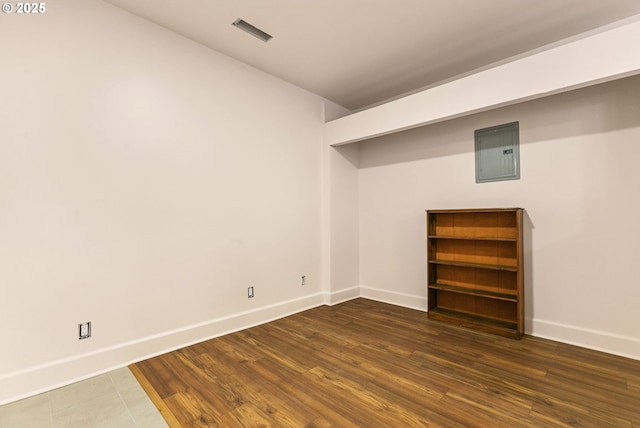 14216 NE 346th St, Battle Ground, WA 98604 - below grade area featuring baseboards, electric panel, and wood finished floors