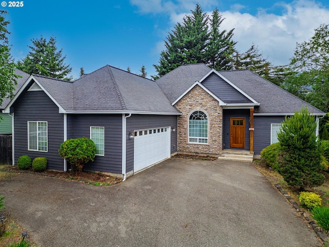 115 Duane Ct, Myrtle Creek, OR 97457 - ranch-style house featuring an attached garage, driveway, stone siding, and roof with shingles